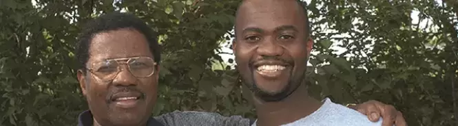 two african americans smiling for camera