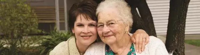 mother and daughter smiling for camera